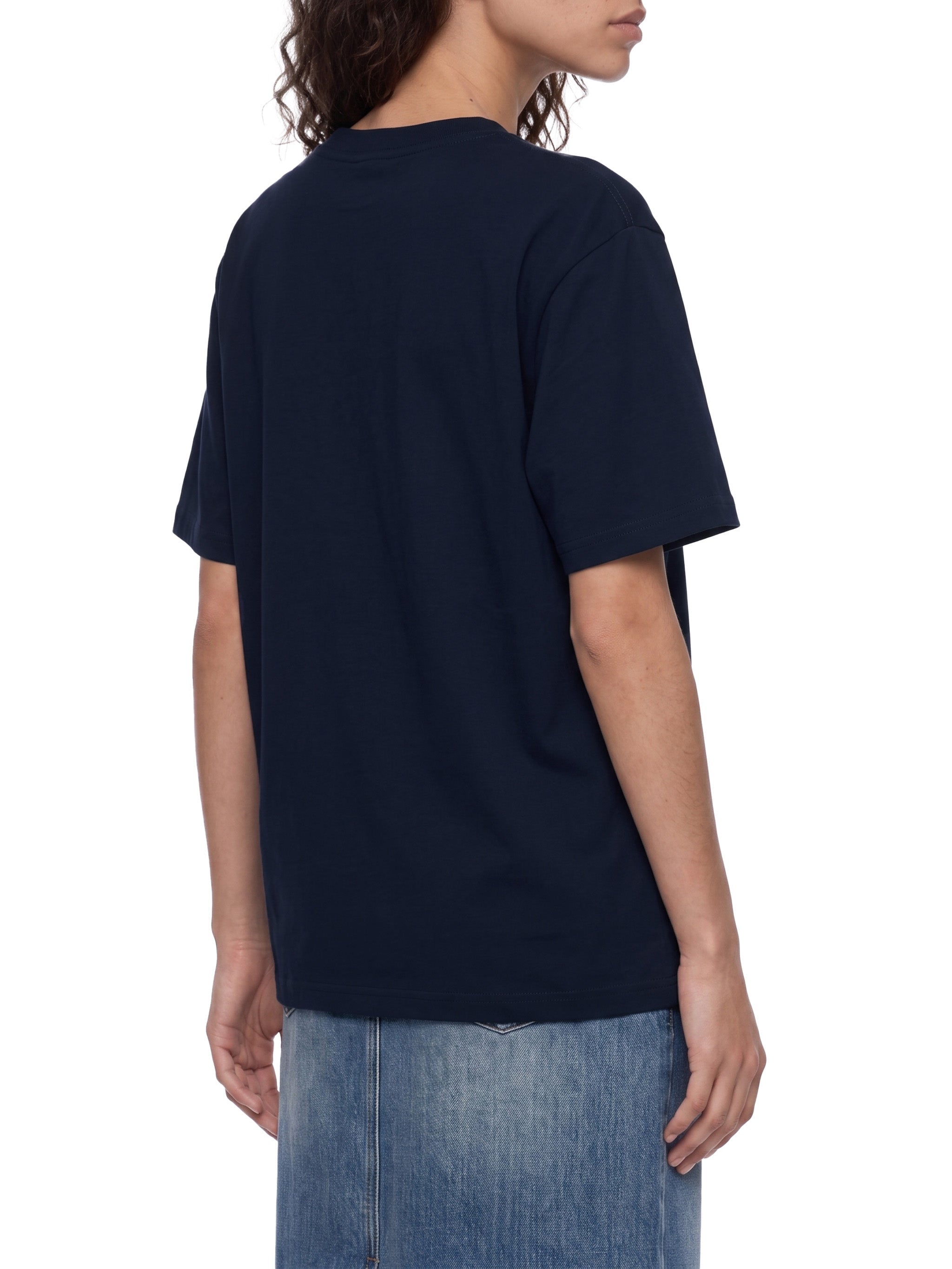 BLANKZ Everyday Cotton Tee — Model wearing the tee, rear three-quarter view