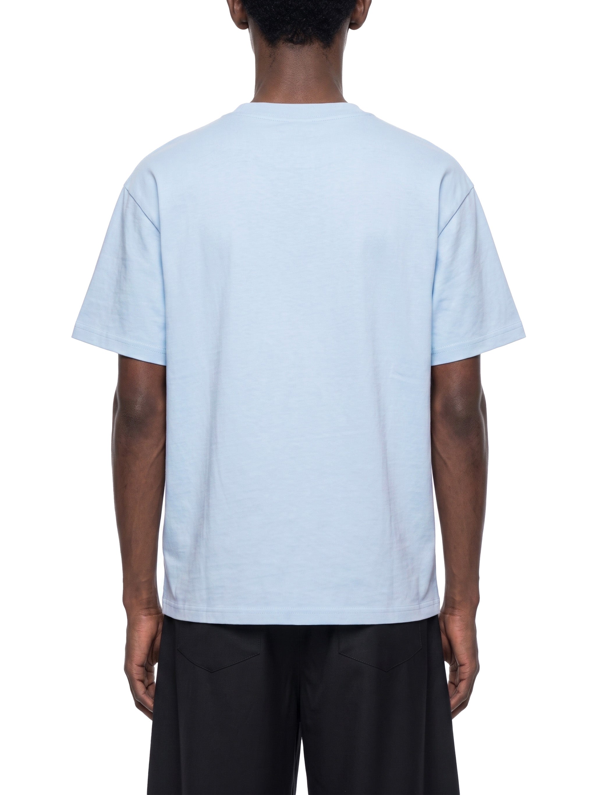 BLANKZ Everyday Cotton Tee — Model wearing the tee, back view