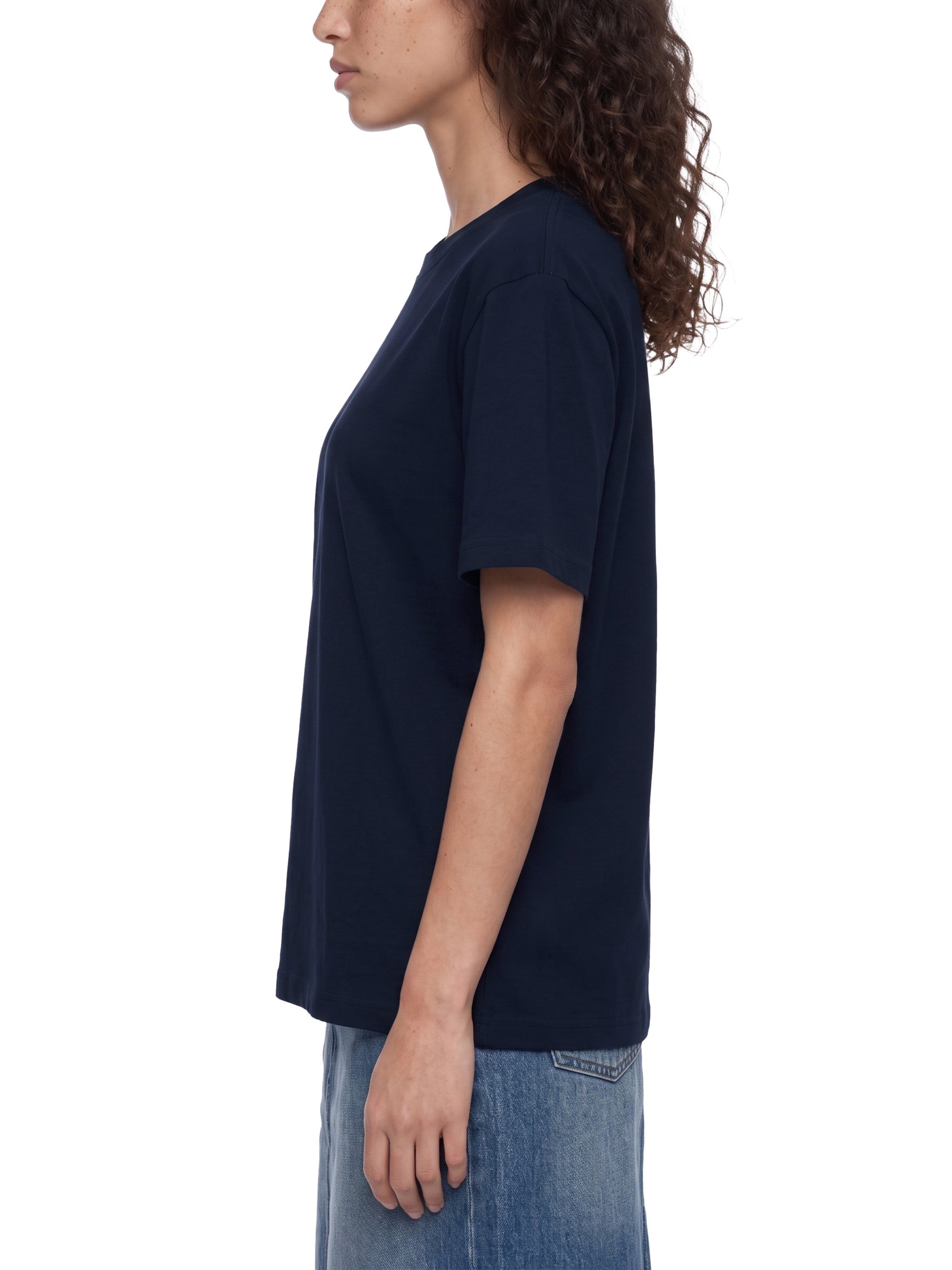 BLANKZ Everyday Cotton Tee — Model wearing the tee, side view