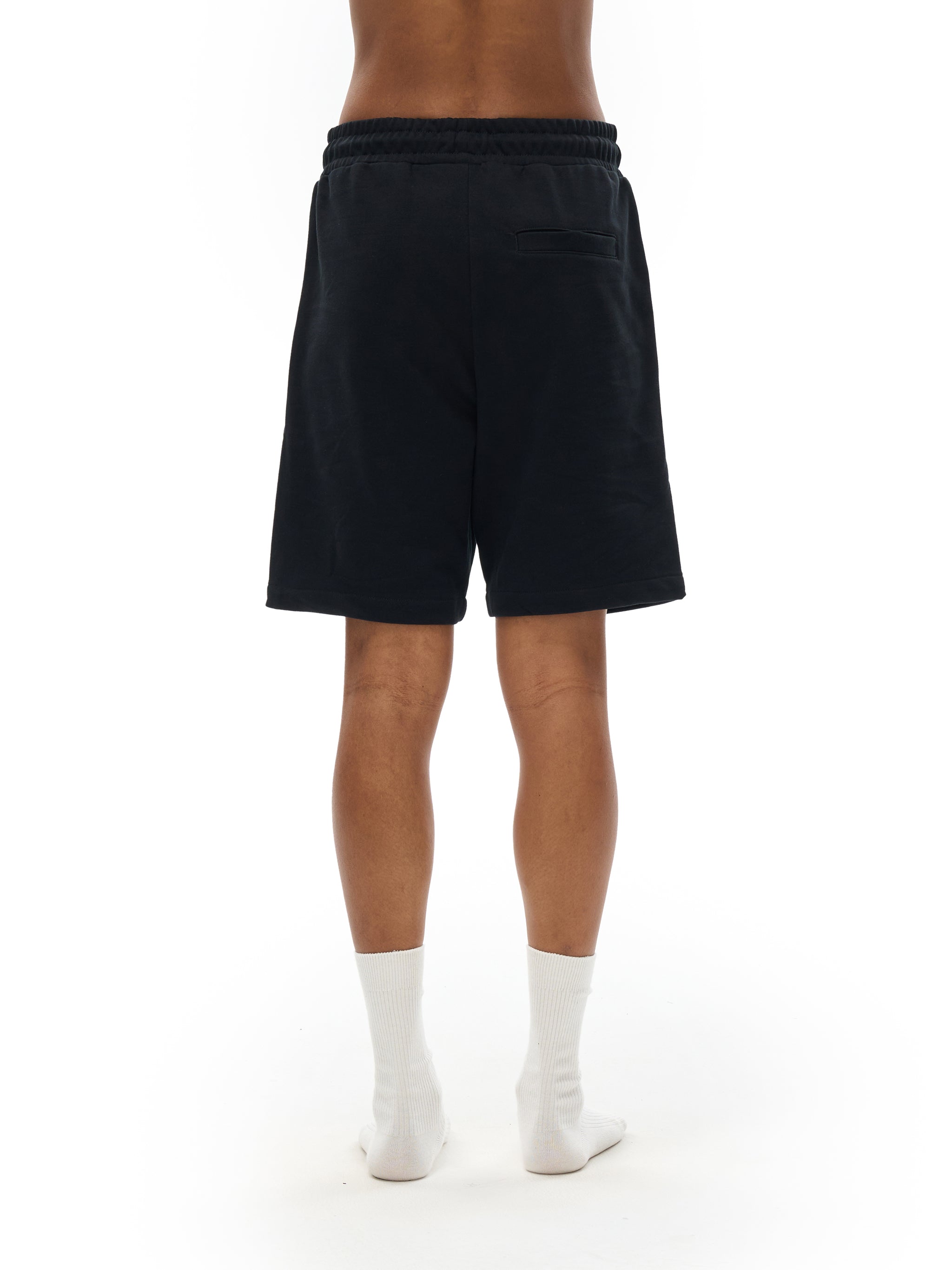 BLANKZ Essential Cotton Short — Model wearing the garment, back view