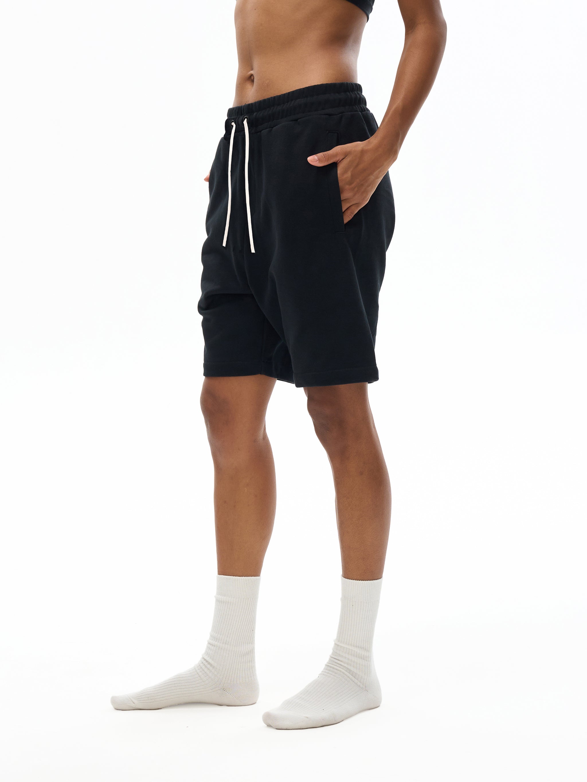 BLANKZ Essential Cotton Short — Model wearing the garment, side view