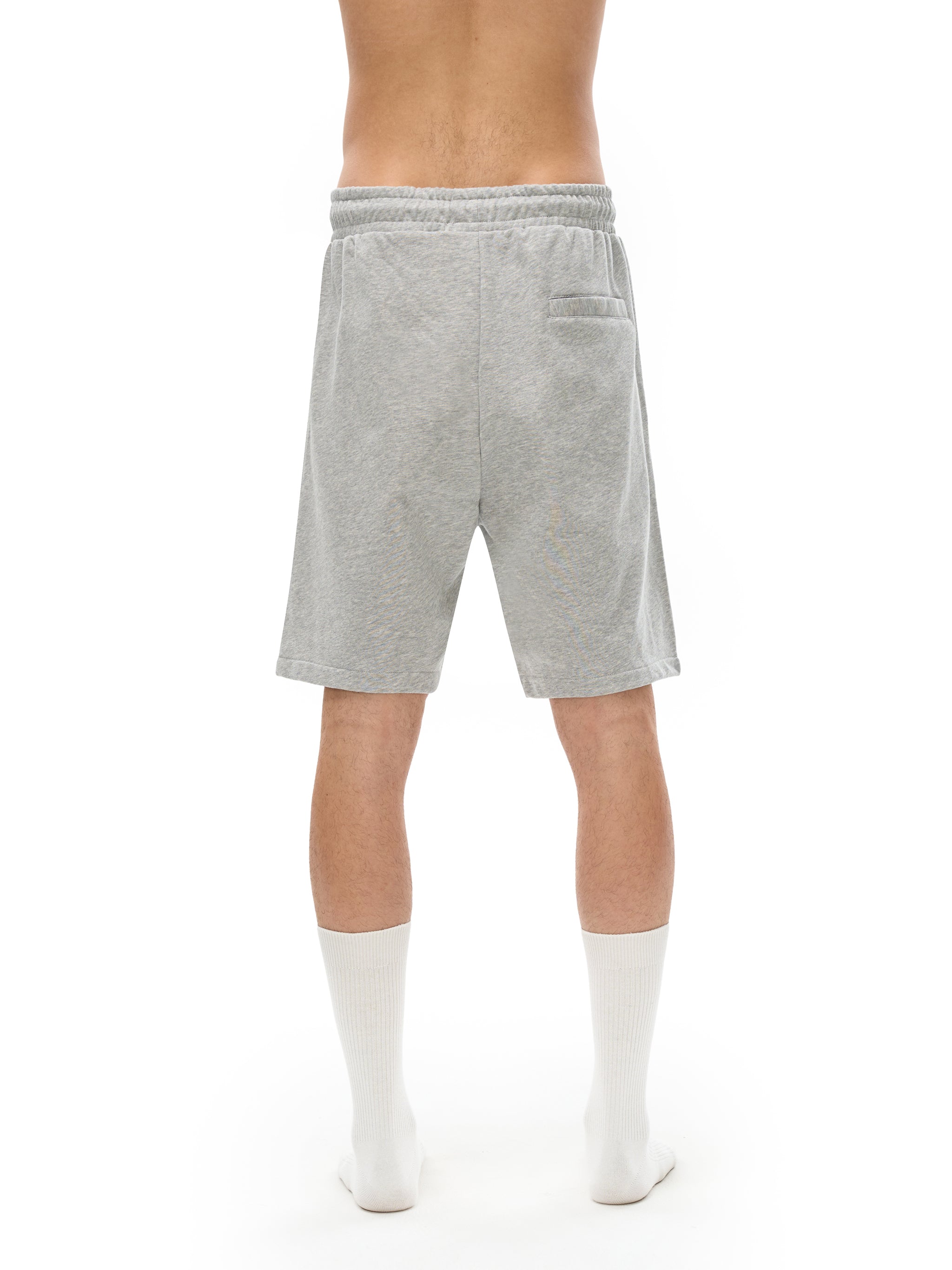 BLANKZ Essential Cotton Short — Model wearing the garment, back view