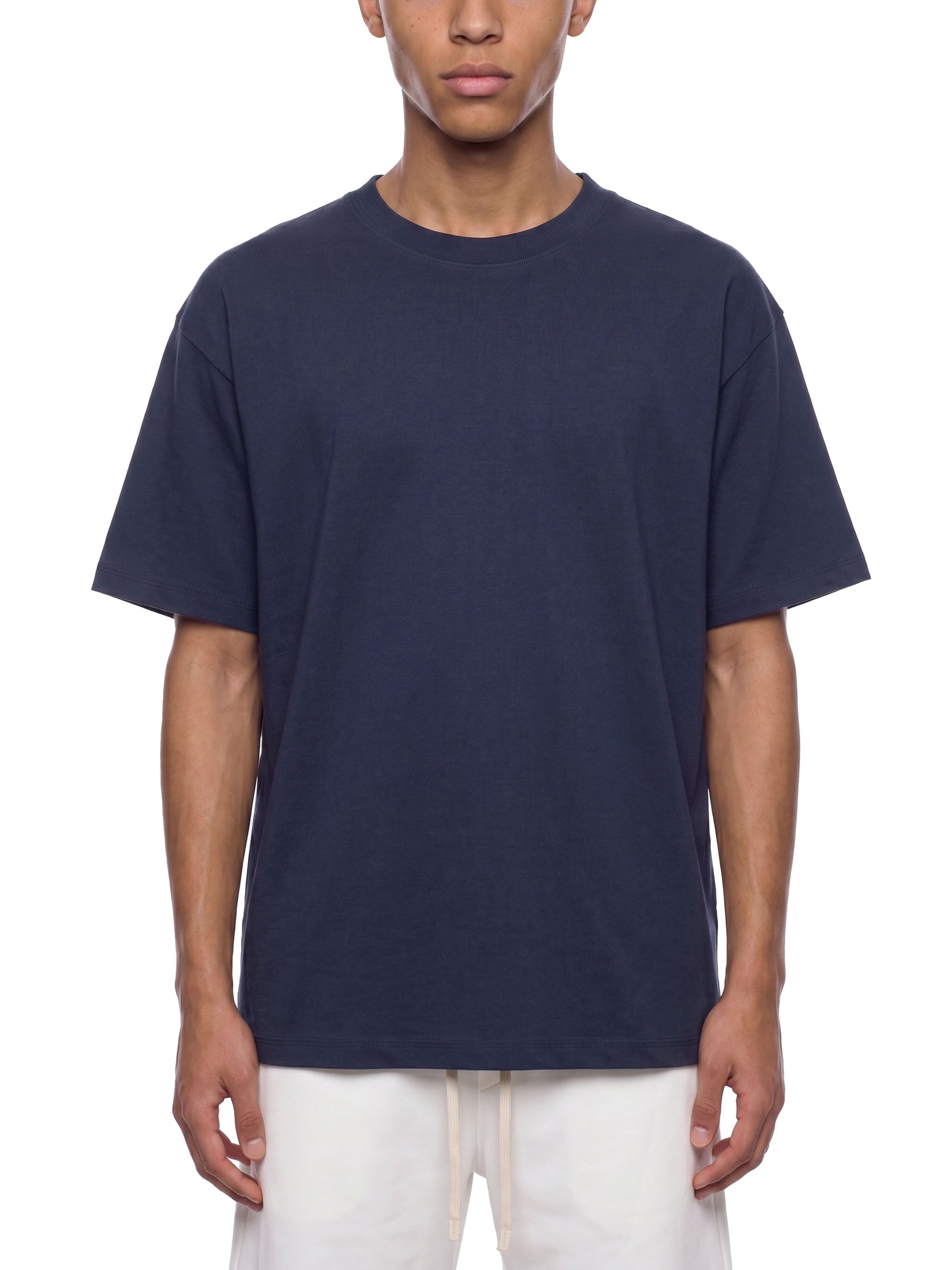 BLANKZ Essential Cotton Tee — Model wearing the tee, front view