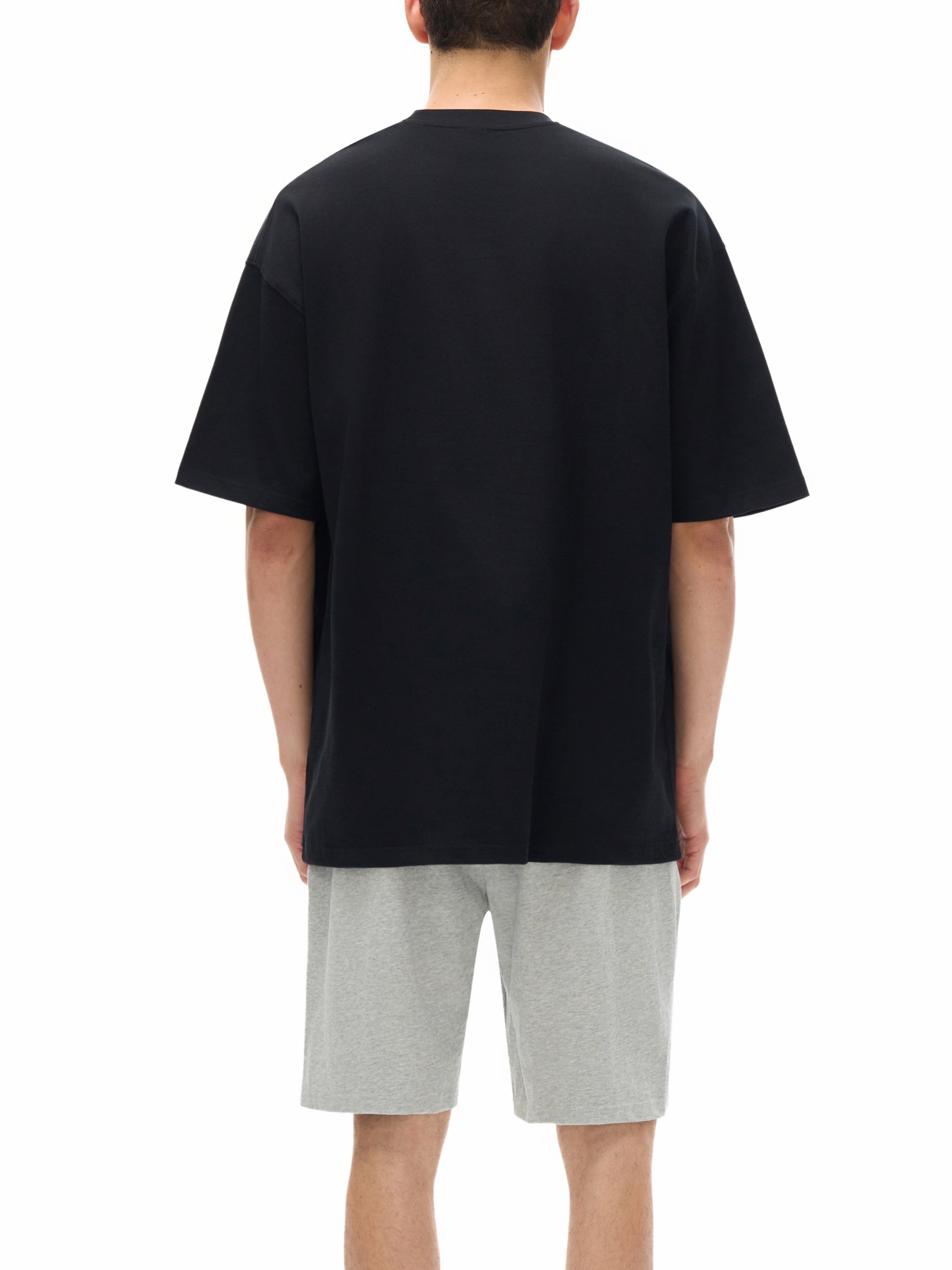 BLANKZ Loose Heavy Tee 275 — Model wearing the tee, back view