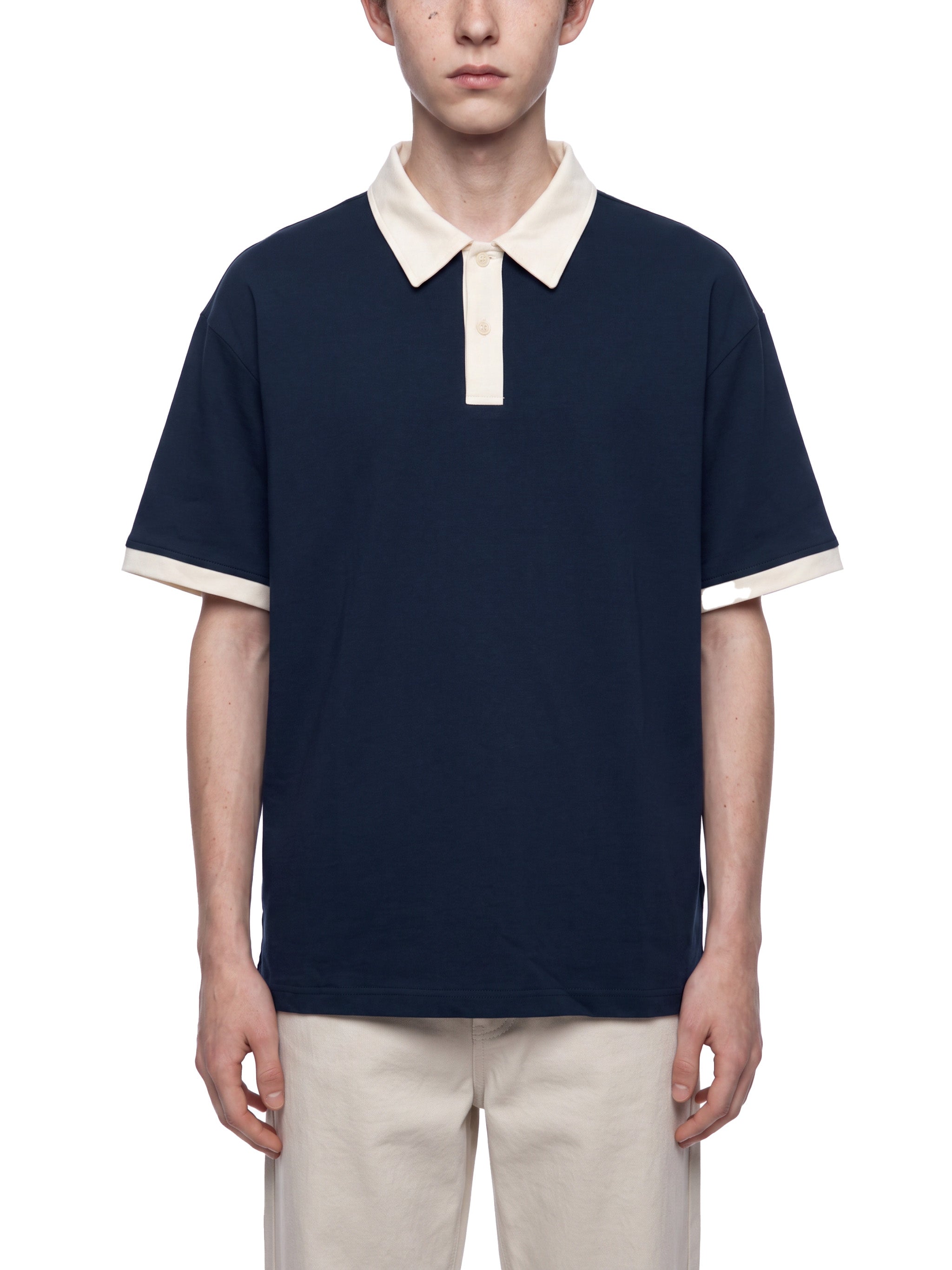 BLANKZ Color Block Polo Shirt — Navy Blue with Apricot — worn front view
