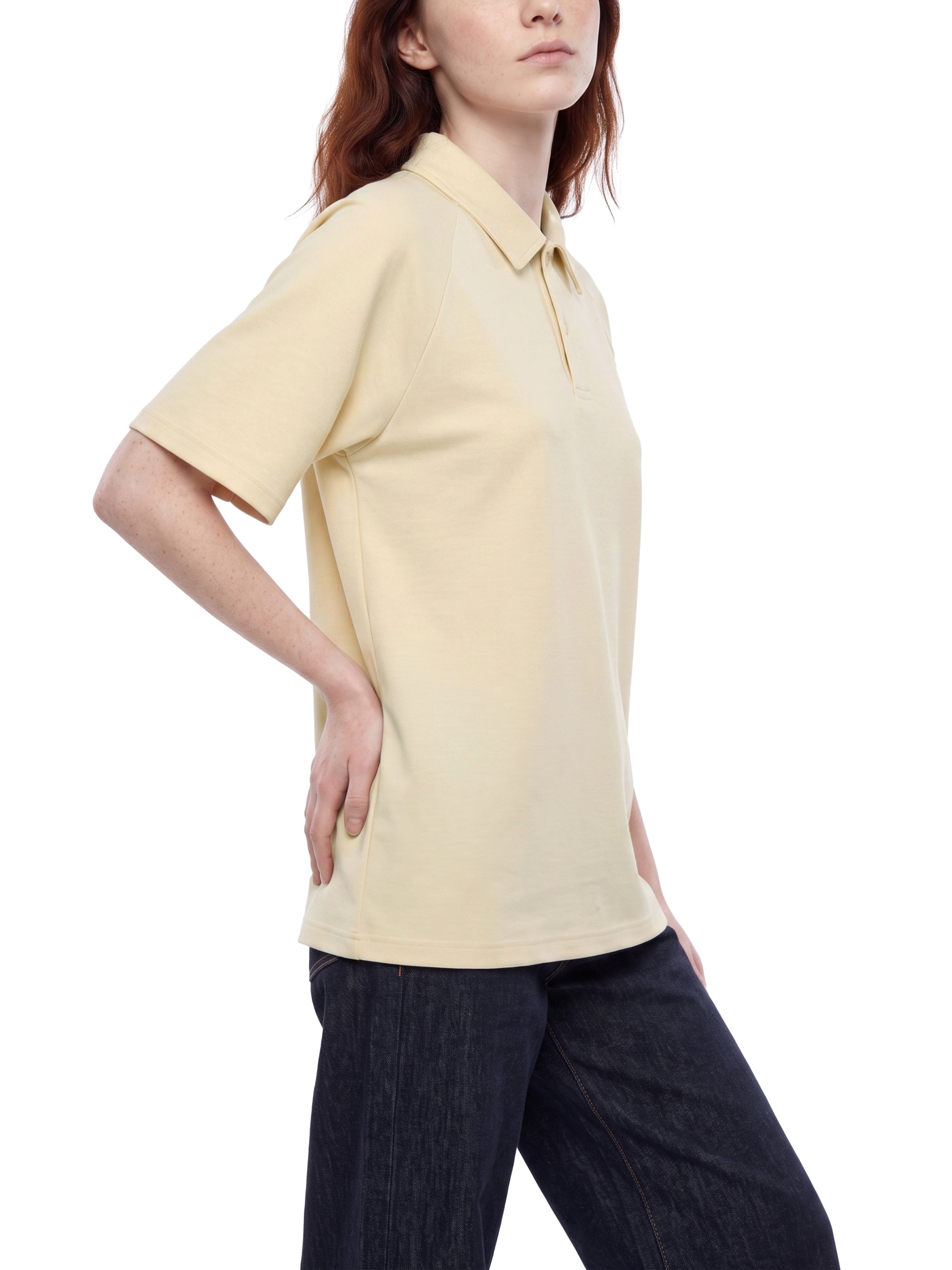 BLANKZ Everyday Raglan Polo — Model wearing the garment, side view