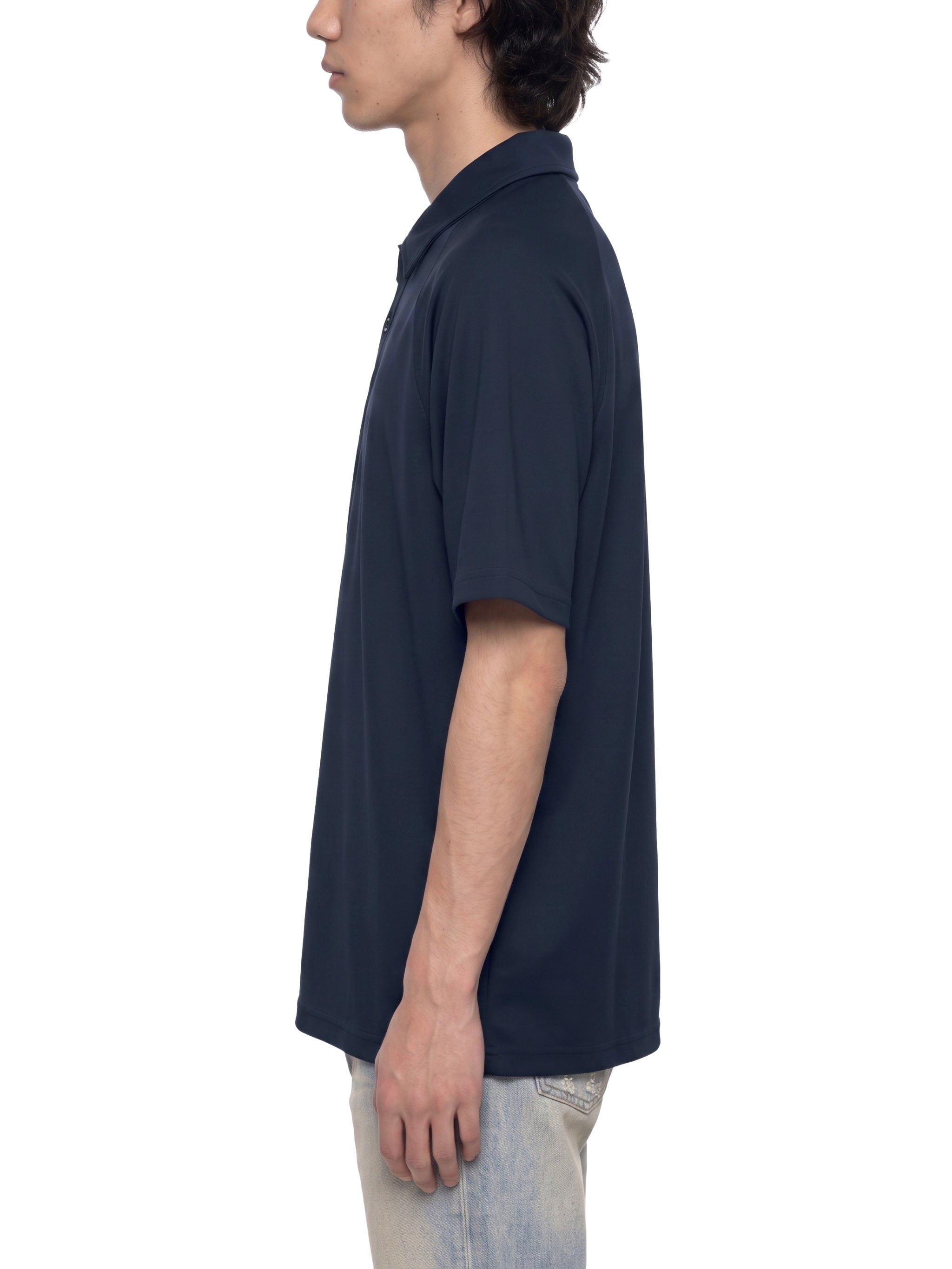 BLANKZ Everyday Raglan Polo — Model wearing the garment, side view