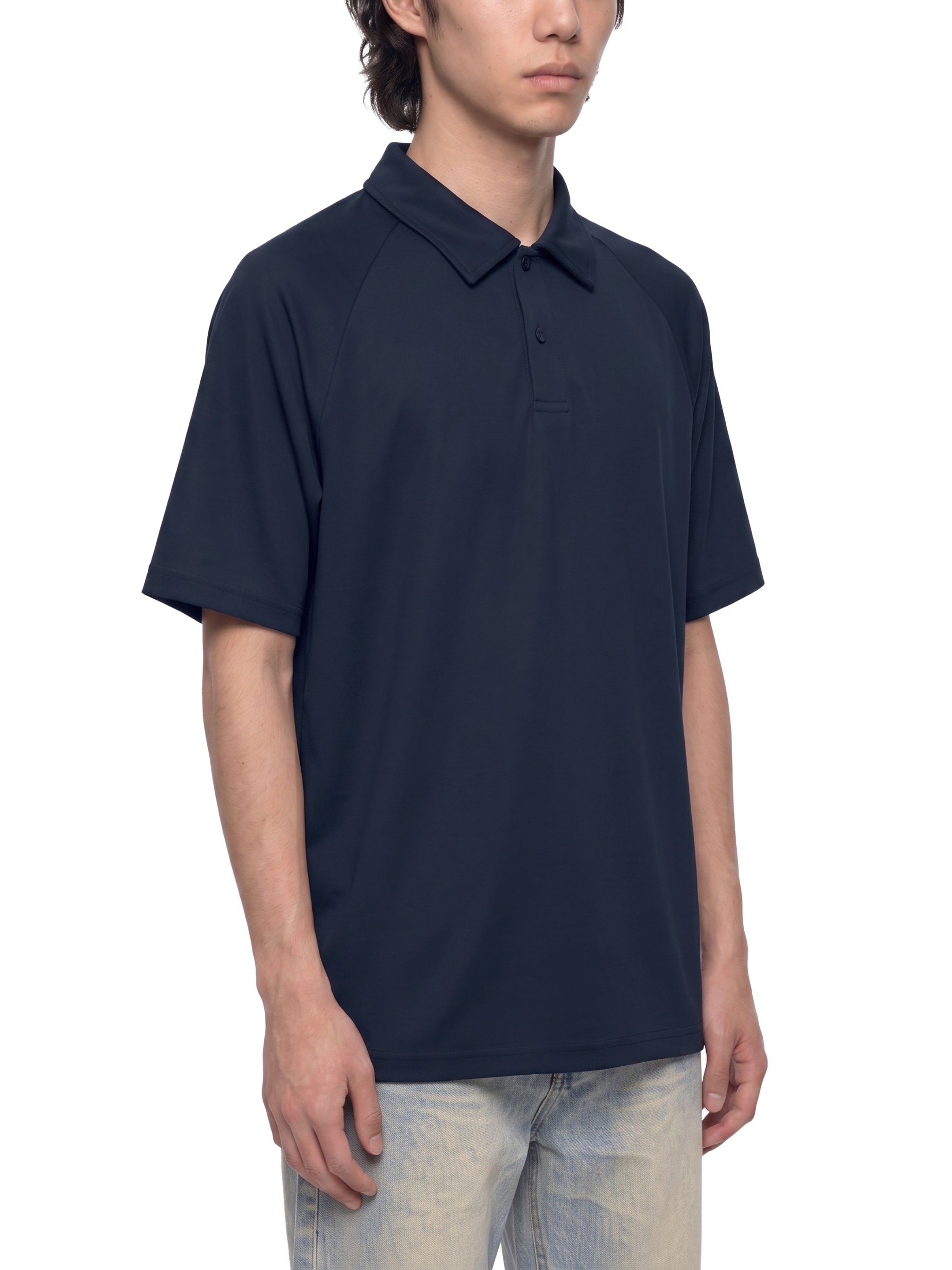 BLANKZ Everyday Raglan Polo — Model wearing the garment, front three-quarter view
