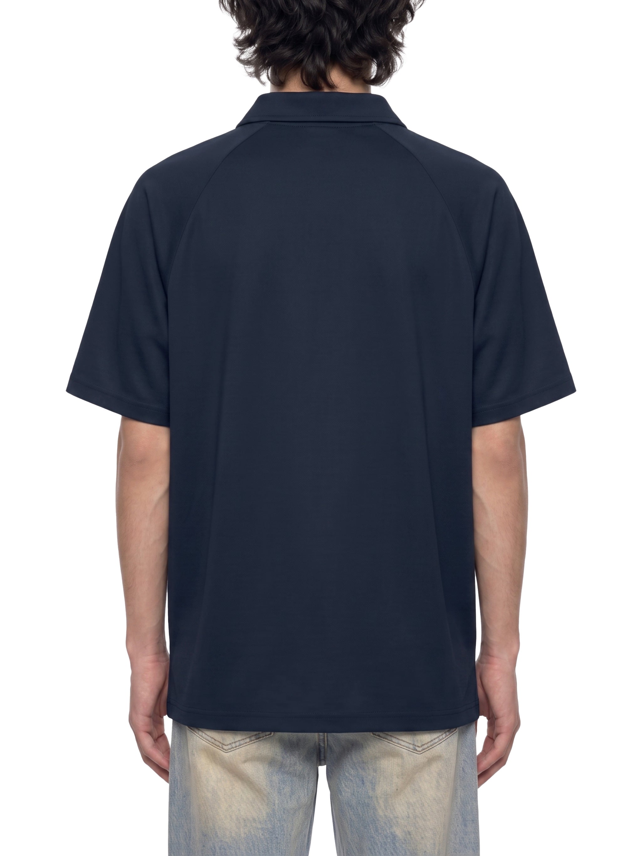 BLANKZ Everyday Raglan Polo — Model wearing the garment, back view