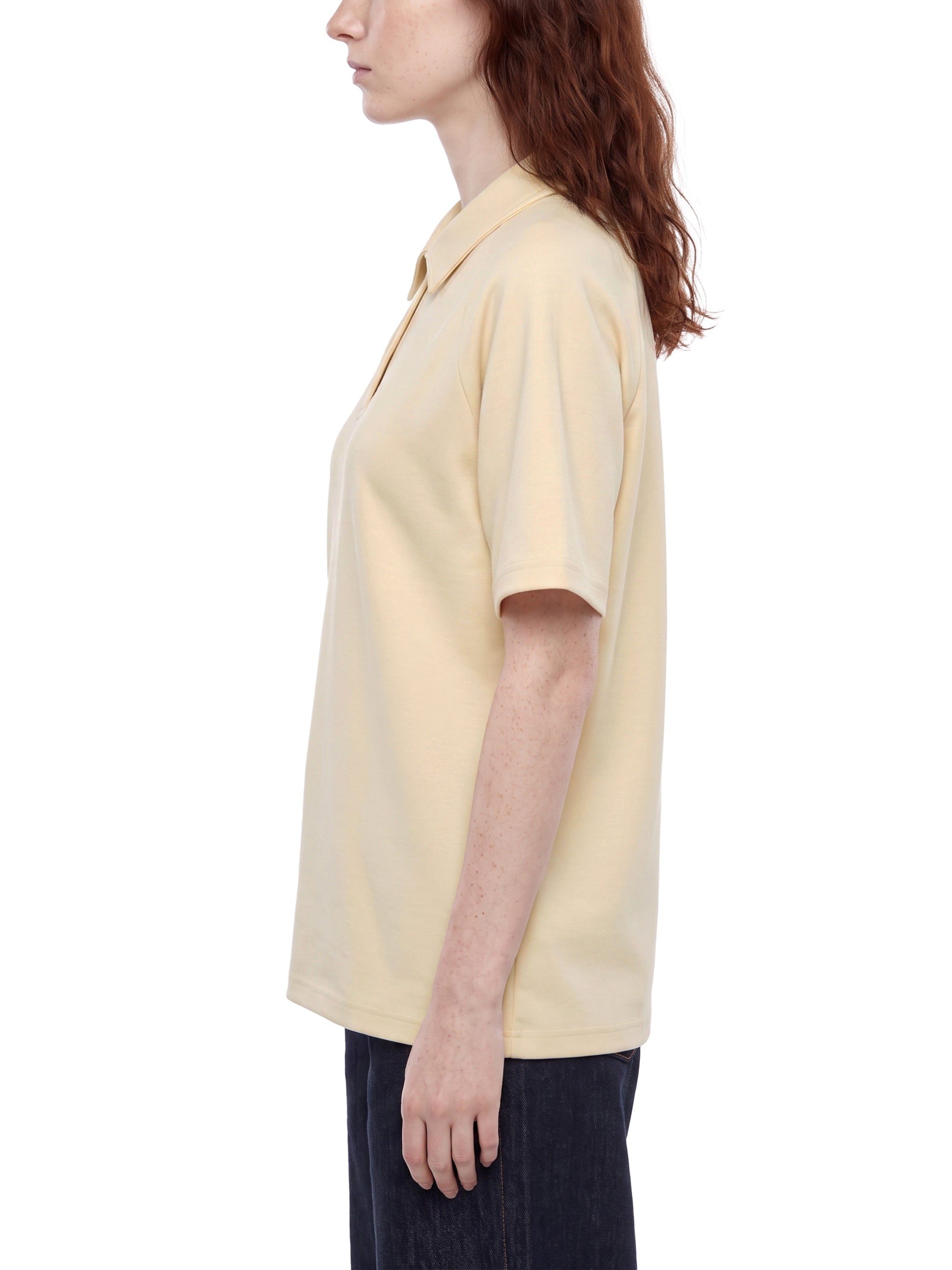 BLANKZ Everyday Raglan Polo — Model wearing the garment, side view