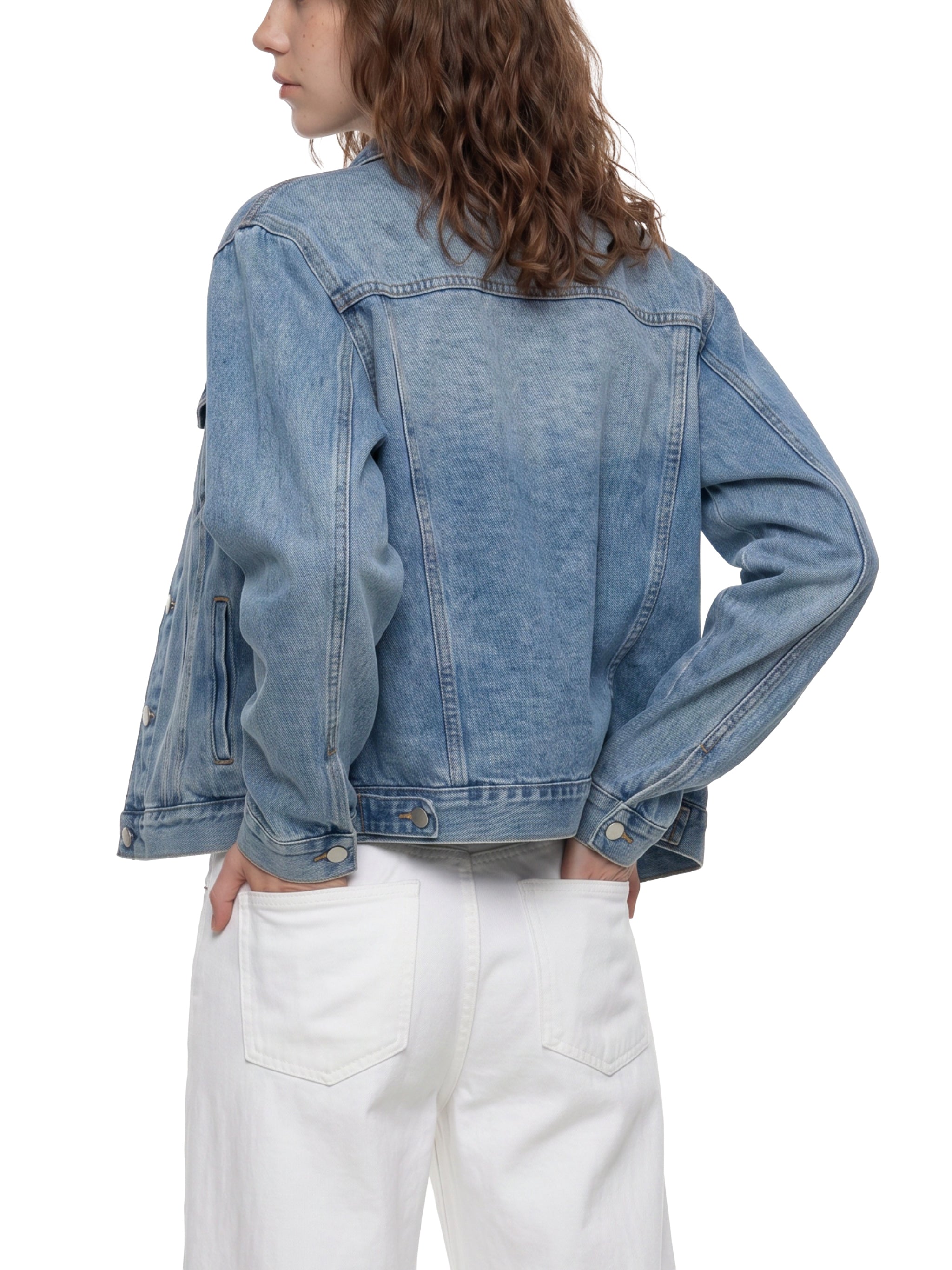 BLANKZ Classic Washed Denim Jacket — Blue, angled back on female model