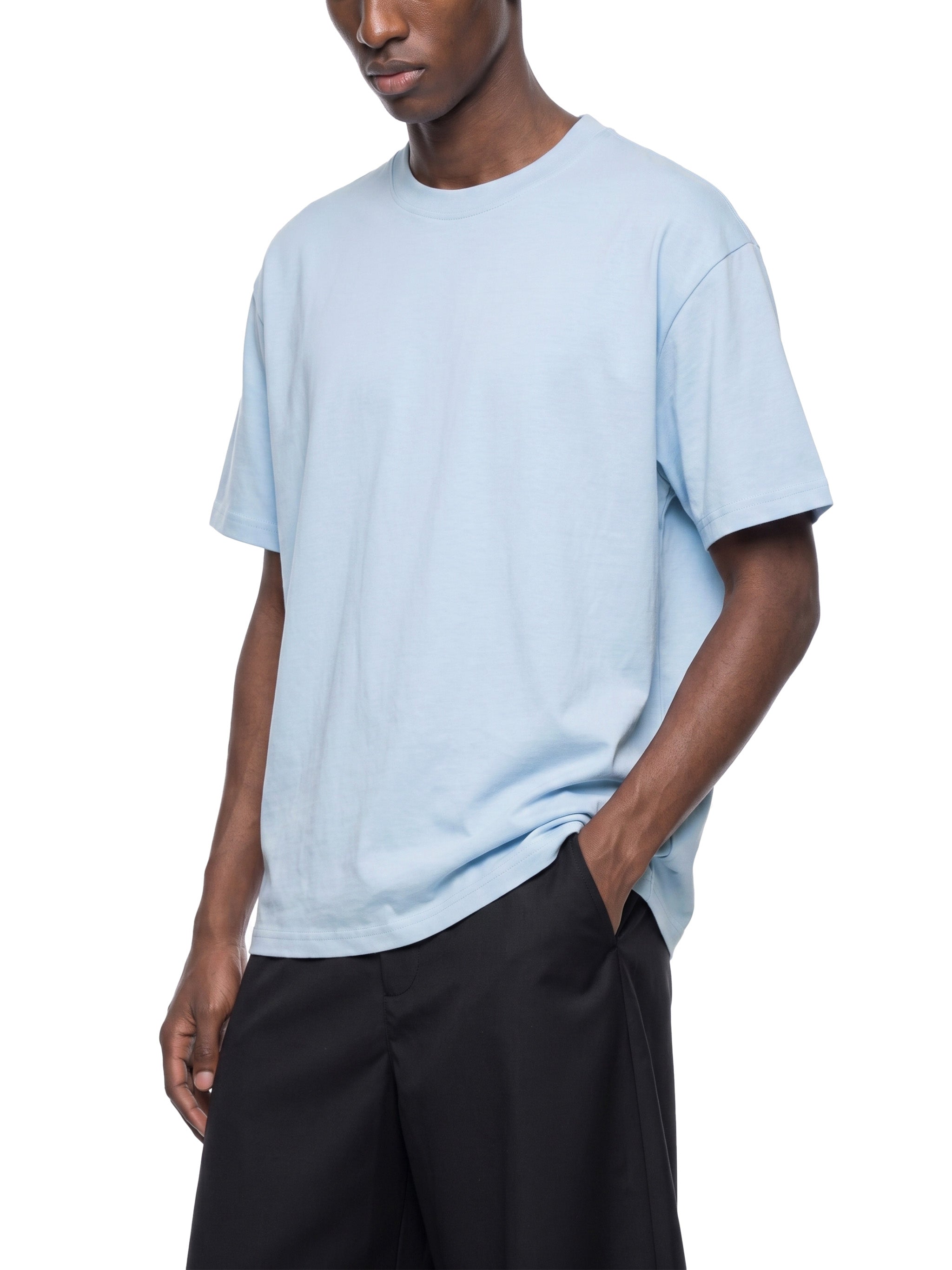 BLANKZ Everyday Cotton Tee — Model wearing the tee, front three-quarter view